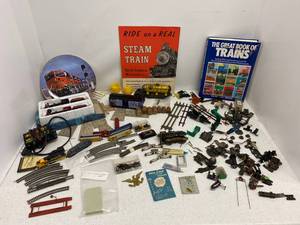 Group of N scale trains, track and parts, Lionel cars and train engine parts.