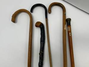 5 Vintage wood canes ( 1 has possible silver on it )