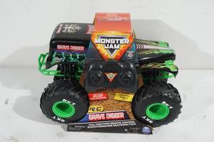 lot 58 image: NEW Monster Jam Grave Digger Remote Control Truck