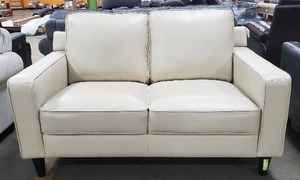 lot 133 image: Abbyson - Milton Leather Loveseat, Cream (Mark on cushion)