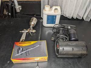 lot 82 image: Collection of Tanning Supplies Tan Easy Portable Spray Tan, Iwata Revolution Air Brushes and St.Tropez Bronzing Mist