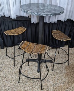 lot 51 image: Stone Topped Bar Height Table with 3 Wicker SeatIron Base Barstools