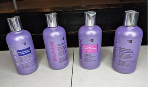 lot 125 image: NEW Set of Four Bottles of Oligo Blacklight Blue and Purple Shampoo and Conditioner