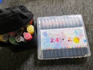 set of water color paint pens and a...