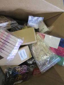 box of fake nails, hair brushes, ha...