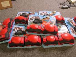 lot of boys knee pads and card and ...