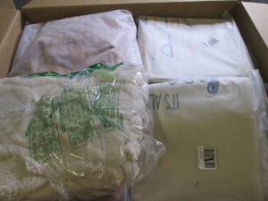 box of decorative pillow covers...