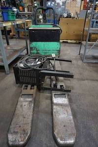 lot 5 image: Mitsubishi PMWR30 24V Ride On Dual Pallet Jack - 6000 Lb Capacity