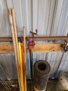 Tool Handles, Roofing Paper, and Three Empty Propane Tanks