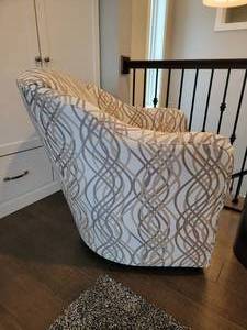 lot 50 image: Armand Swivel Chair by Sam Moore, a