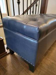 lot 57 image: Tufted Gun Metal Blue Leatherette Chest Ottoman