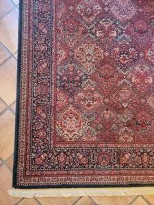 lot 43 image: Couristan 100% Wool Area Rug  4.6 x 6.8