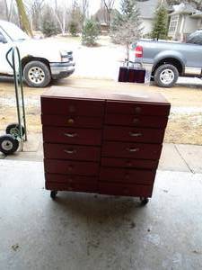 Wood storage cabinet. 14 drawers with contents. As shown.