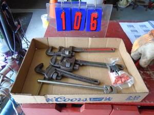 Flat of vintage pipe wrenches & basin wrench. As shown.