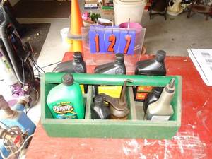Wood tote of motor oil & chemicals. As shown.