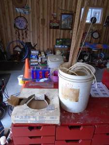 Partial spool of 122 wire & bucket of wire. As shown .