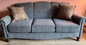 lot 1 image: Blue Couch and Throw Pillow