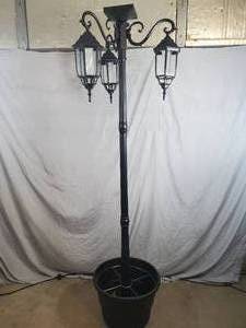 lot 1 image: New Solar Powered LED Light Post