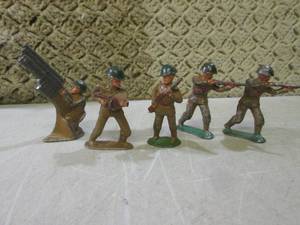 lot 19 image: (FS) Vintage Cast Iron Military Sol...