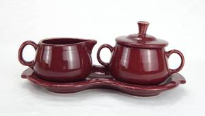 lot 84 image: Cininabar Sugar and Cream Tray Set