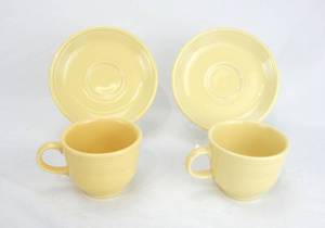 lot 158 image: Two Yellow Cups and Saucers
