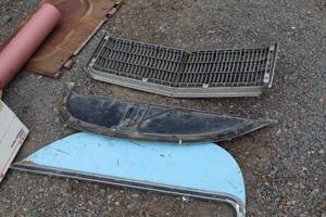 lot 581 image: Vintage Ford Grill, Auto Wheel Shields (x2)