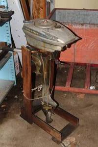 lot 392 image: Champion Blue Ribbon Boat Motor with Boat Motor Stand