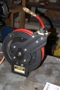 lot 439 image: Central Pneumatic Auto Rewind Air Hose Reel, Air Hose 25x38 NPT