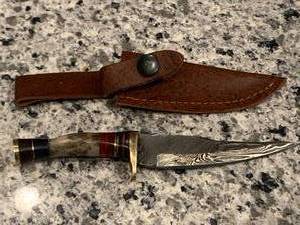 lot 24 image: Custom Made Stag Handle Damascus Knife 7 Inch