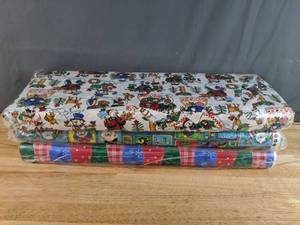 lot 92 image: Collection of Colorful Christmas Theme Fabric Bolts Snowmen, Bears, & Solid Colors - Z