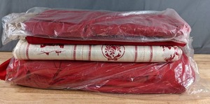 lot 219 image: Three Bolts of Solid Red Fabric and One Bolt of Christmas Themed Fabric - Z