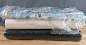 lot 220 image: One Bolt of Charlie Brown Christmas Fabric and Two Bolts of Solid Color Fabric - Z