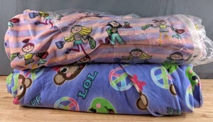 lot 202 image: Two Bolts of Multicolored Fleece Fabric (Girls ShoppingAnimals) - Z