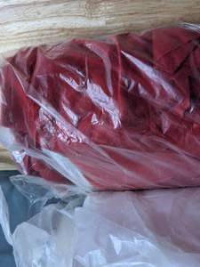 lot 522 image: Lot of Three Bolts of Fabric - One Off-white, Two Dark Red