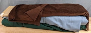 lot 508 image: Three Bolts of Solid Colored Fabric (Brown, Blue and Green) - Z