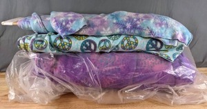 lot 533 image: Three Bolts of Pastel Fleece Fabric (Snowflakes, Peace Signs, CirclesDots) - Z
