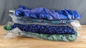lot 310 image: Four Bolts of Fleece Fabric (Blue Tie Dye, Green Wavy, Animal Print, Green Print) - Z