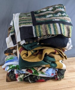 lot 324 image: Stack of Patterned Fleece Fabrics (Outdoors Type Prints, Christmas Cardinals and More) - Z