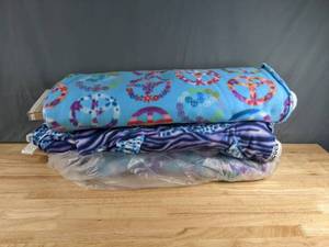 lot 267 image: Collection of Peace Sign, Cheetah & Zebra Print and Airbrushed Themed Bolts of Fleece - Z