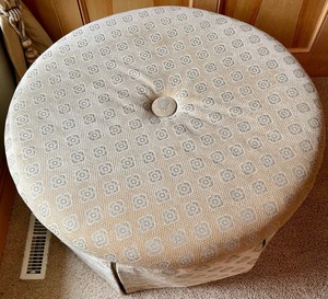 lot 21 image: Charming Round Upholstered Cream Ottoman