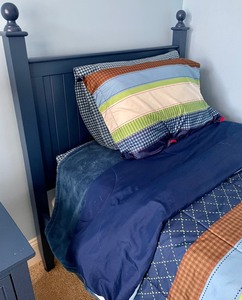 lot 80 image: Navy Blue Twin Bed with Bedding