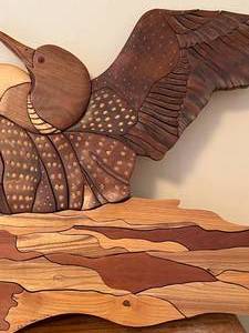 lot 90 image: Carved Wood Loon Wall Hanging