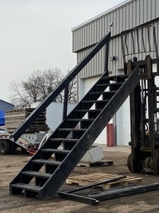 Set Of Wooden Stairs With Handrail