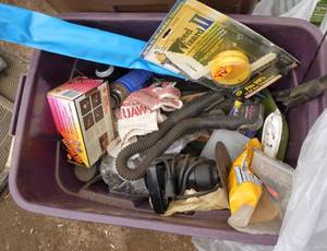 Tote full of misc garage stuff from sanders to snake light and dust pan