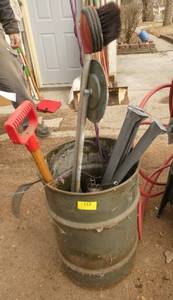 Barrel of stuff - planter wheel, car brush, grease gun, horse whip, rake, mower blade, etc