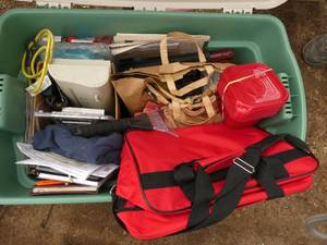 Tote full of stuff - storage containers, flood lights, GFI outlet, tape, window scraper, rags