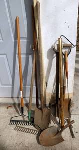 Lot of shovels, rakes, potato fork