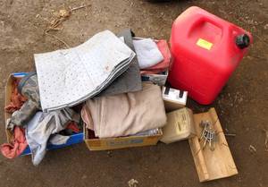 Garage supplies, shop rags, light, gas can, mitre box