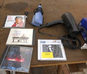 4 CDs of MeatLoaf, Elvis, Forrest Gump - Hair dryer and hair straightener - and a bag of shop rags