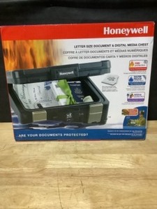 Honeywell 0.24 cu. ft. Molded Fire Resistant and Waterproof Portable Chest with Carry Handle, Key and Double Latch Lock. See Pictures